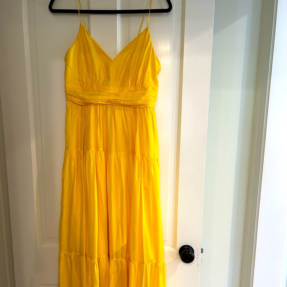Intermix cotton maxi dress with adjustable straps and side zipper.